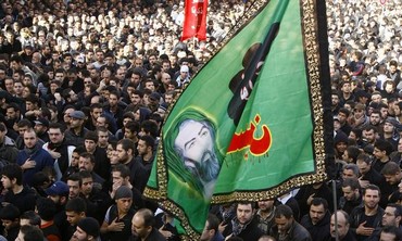 Lebanon's Hezbollah supporters chant slogans and hold flags