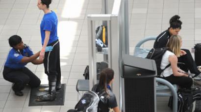 A passenger is patted down by a Transportation Security Administration agent.(AFP Photo / Stan Honda)
