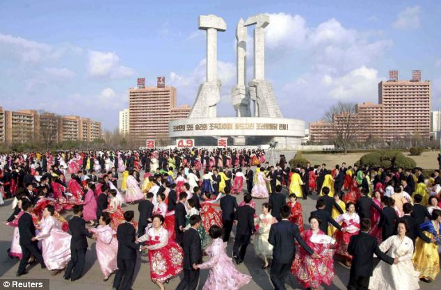 Thousands of North Koreans dance in Pyongyang in celebration of their former leader Kim Jong-Il