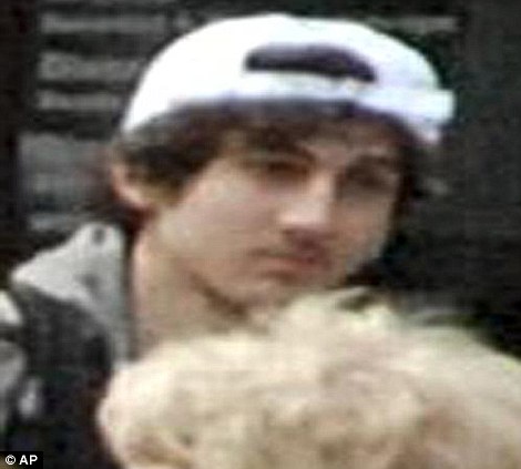 This photo released by the FBI early Friday April 19, 2013, shows what the FBI is calling suspect number 2 behind 