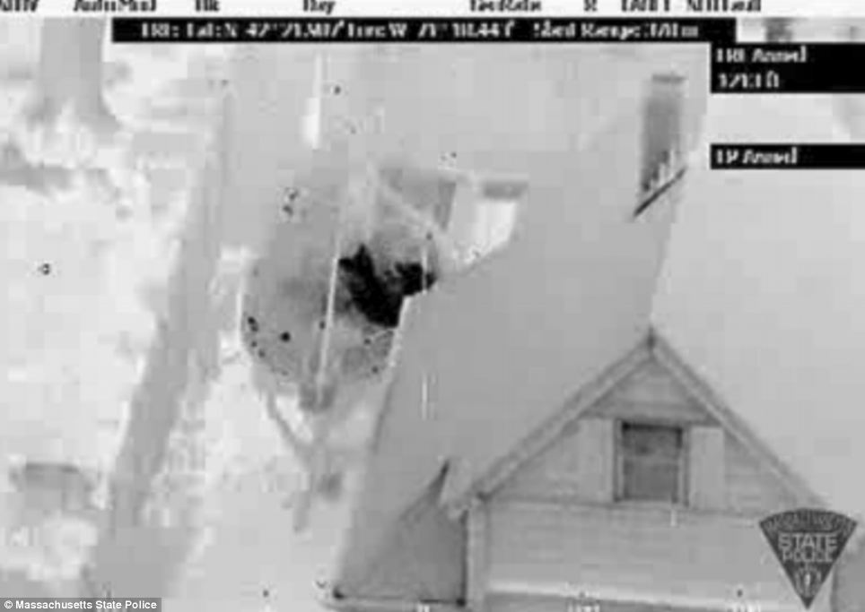 In hiding: The dramatic footage released by police shows where the teenager lay hiding in a boat in the quiet suburban neighbourhood of Watertown 